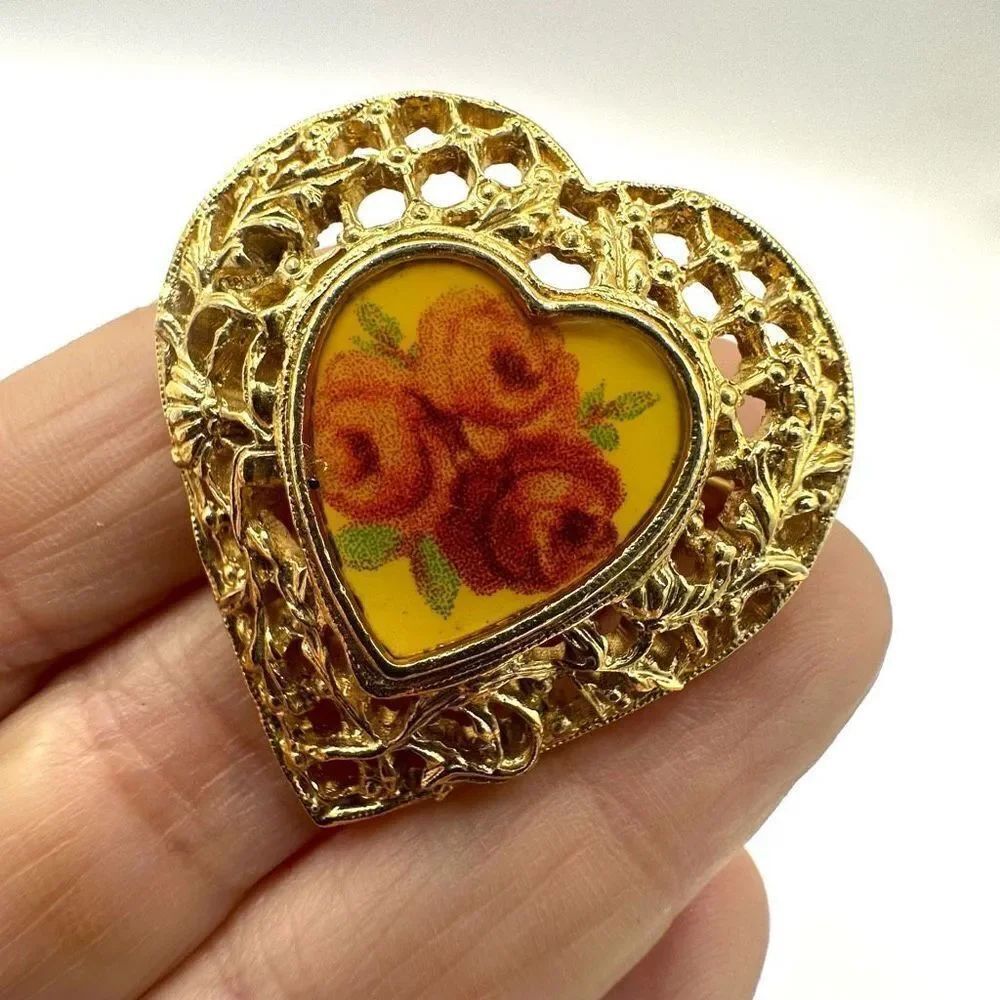 Gold tone heart flower brooch